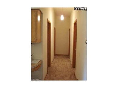 The hallway leads to the home's private living qua