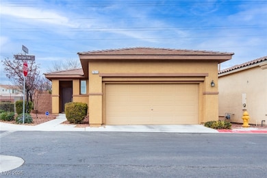 View of front facade with stucco siding, a tiled r