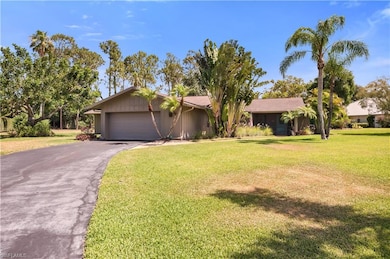 View of front of property featuring driveway and  attached garage
