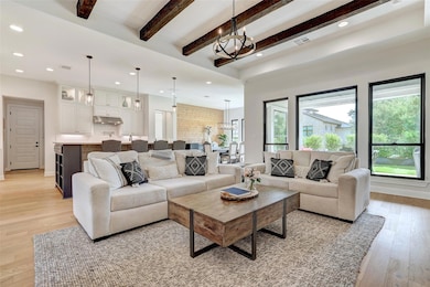 Living room with plenty of natural light, a chand