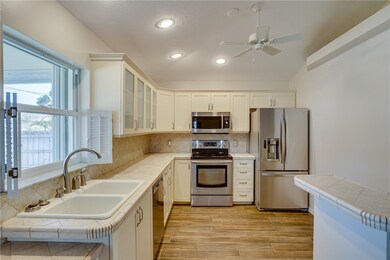 Light and bright kitchen overlooking backyard