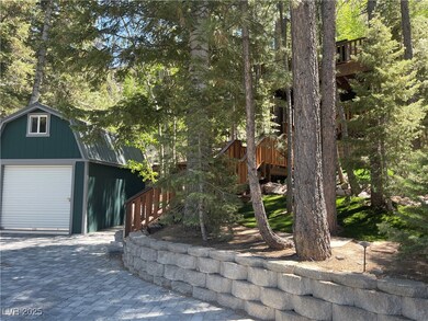View of front of property with an outdoor structur