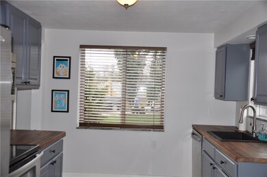 The picture window fills this kitchen with sunligh