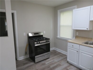 Kitchen with stainless steel range with gas stovet
