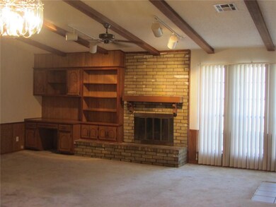 Wood-burning fireplace, built-in bookcase & desk. 