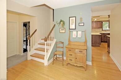 Hardwood flooring in entry, living roon, dining ro