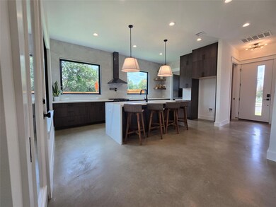 Kitchen with wall chimney exhaust hood, modern ca
