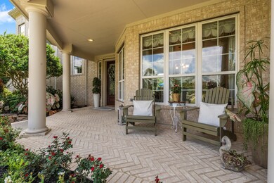 Charming covered front porch is perfect for watchi