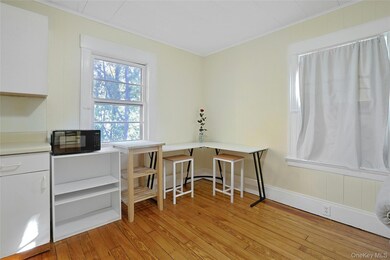 Office space featuring light wood-style floors and ornamental molding