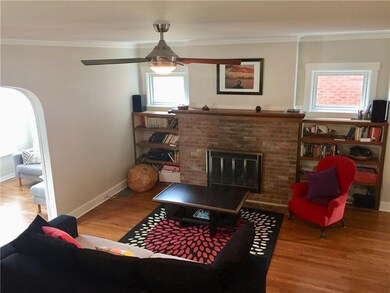 Stone gas burning fireplace in living room.