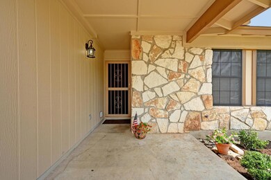 Entrance to property with stone siding