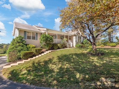 Lushly landscaping front of home on .96 acres