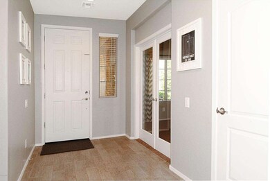 French doors to den off entry