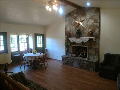 Dining room, open concept to living room with fireplace
