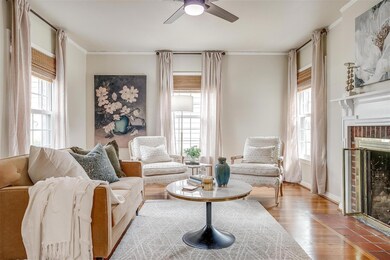 Living room featuring a ceiling fan, wood finished