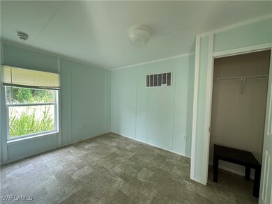 Unfurnished bedroom featuring a closet and tile patterned flooring