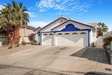 View of front of home featuring a garage, stucco s