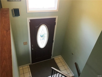 Foyer leading to family room