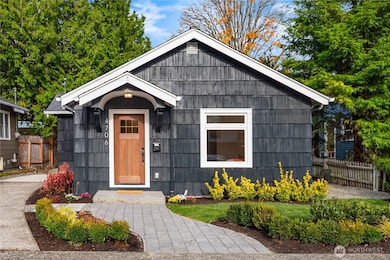 The exterior features all new paint and landscaping including this paver sidewalk and a paver patio in the backyard.