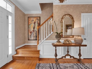 Foyer entrance featuring crown molding, a wealth o