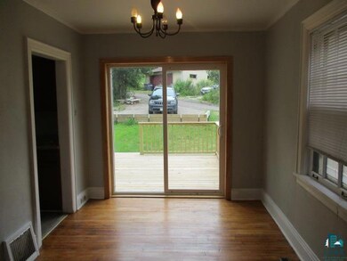Doorway featuring hardwood / wood-style flooring a