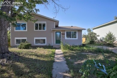 Tri-level home with a front yard
