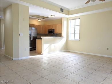 Kitchen featuring ornamental molding, a peninsula,