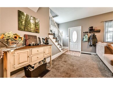 This inviting entrance leads into the living room