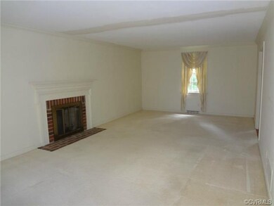 Living Room with Brick Fireplace