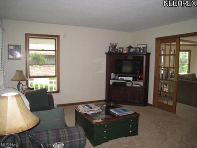 Living room with French doors into great room.