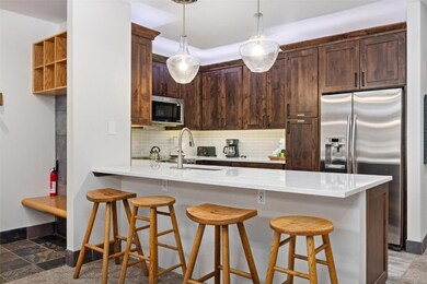 Kitchen with tasteful backsplash, a kitchen breakf