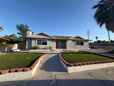 Ranch-style house featuring stucco siding
