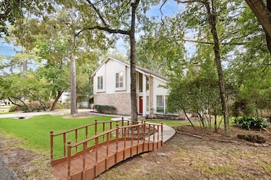 Delightful corner lot has a front yard bridge adds charm and character.