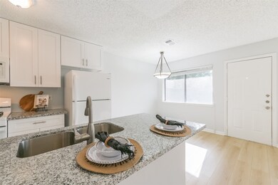 Kitchen has beautiful granite.
