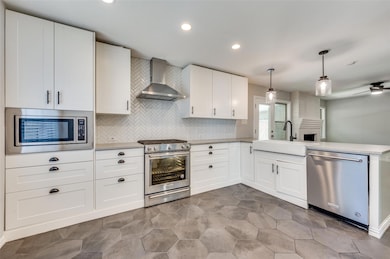 Updated Kitchen featuring ceiling fan, stainless s