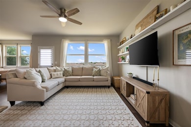 Living room featuring ceiling fan