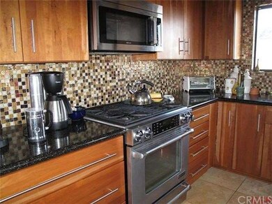 Take a closer look at the glass tile and cabinets