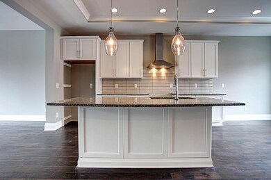 Large island w/granite and bar top