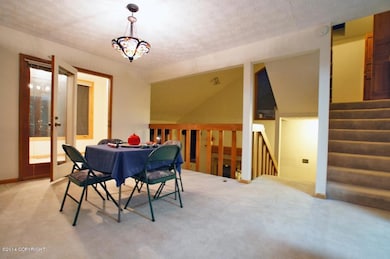 dining area with door to bonus room