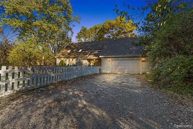 View of home's exterior with driveway and an attached garage