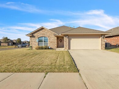 Ranch-style home featuring cooling unit, a garage,