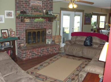 lr area view w/wood burning fp,  doors to back dec