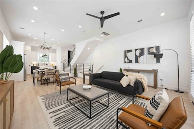 Open concept living/dining/kitchen. Photo of the model home (finishes and specifications may vary)