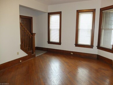 Parlor with hardwood flooring.