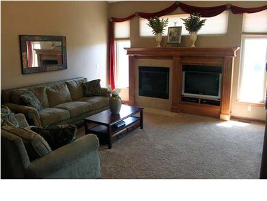 Living room on main floor has custom fireplace wit