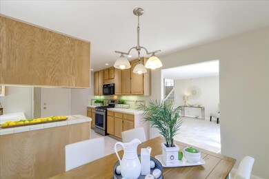 The kitchen and dining room open up to the family 