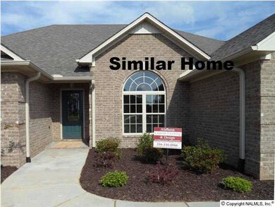Notice the brick work including coins. Notice the attention to detail such as the gutters being drained to the yard verus the flower bed. Picture from similar home.