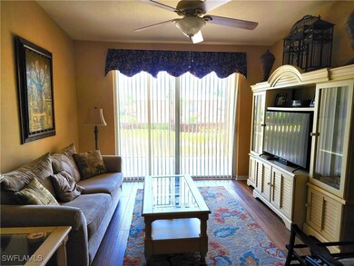 Living room with dark hardwood / wood-style floors