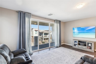 Living room with hardwood / wood-style floors