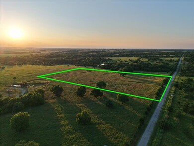 Aerial view at dusk of a rural view and property parcel outlined